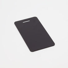 Black, ready-to-machine anodized aluminum luggage tags for your next CNC project.